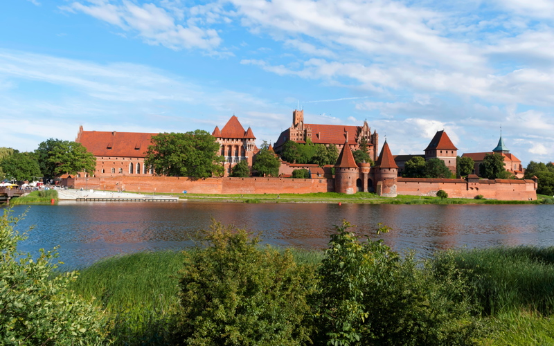 1 - Malbork Castle, a massive 13th-century Brick Gothic fortress in Malbork, Poland, seen from across the Nogat River